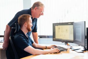 Engineers working on computer